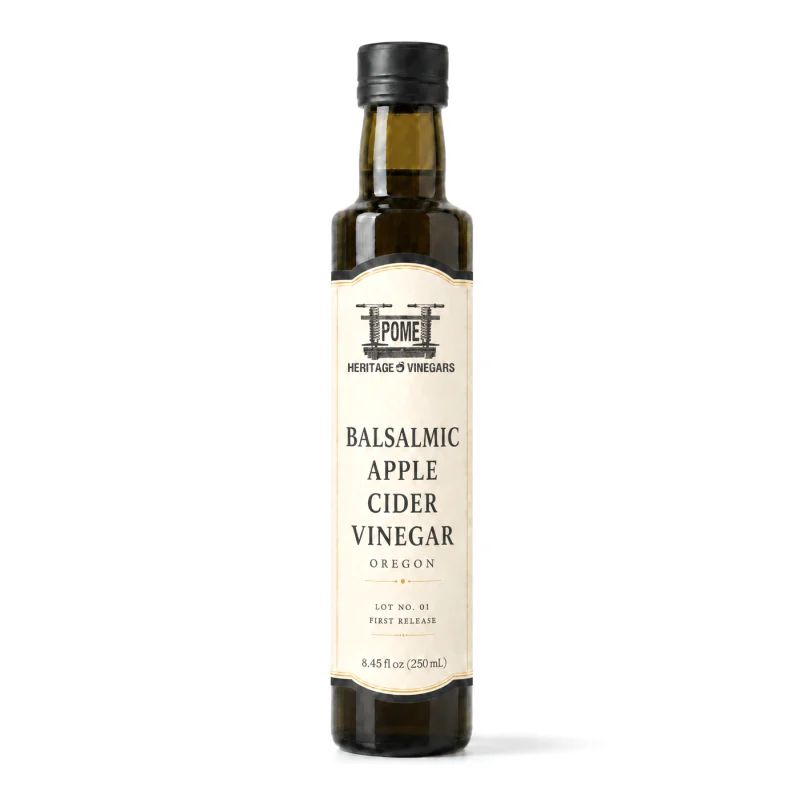 A dark glass 250 ml bottle of POME Balsamic Apple Cider Vinegar with a cream label and black cap.